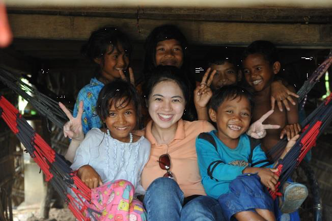 Jacqueline With The Village Kids At Prey Kabas Taking Shelter From The Rain During A Video Shoot